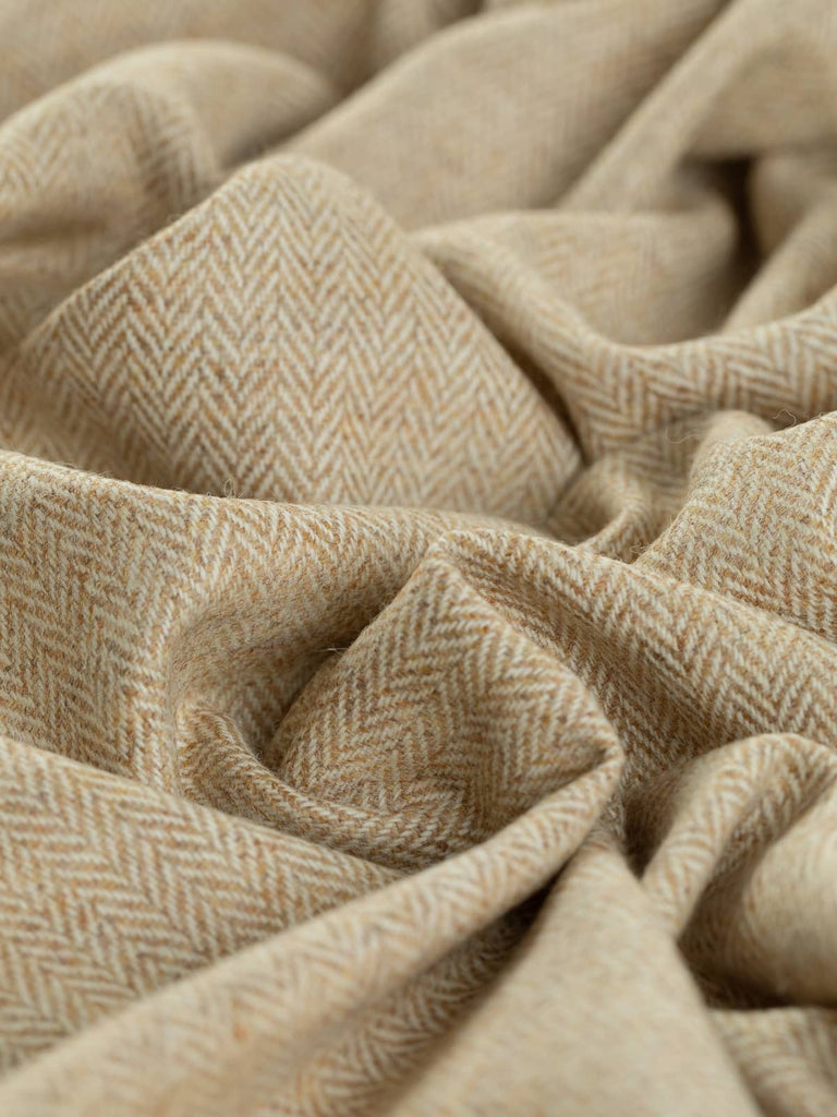 Angled close-up of twisted Yorkshire Tweed Herringbone in Grandma's Shortbread, highlighting the intricate herringbone pattern. The warm golden tones and soft cream hues twist together, resembling sun-ripened wheat sheaves with a cosy, inviting texture.