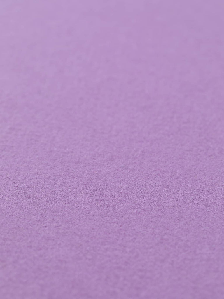 Flat angled view of Violet Cream Twill Melton, 152cm wide, displaying closely woven structure with obscured twill lines and romantic, whimsical violet hue