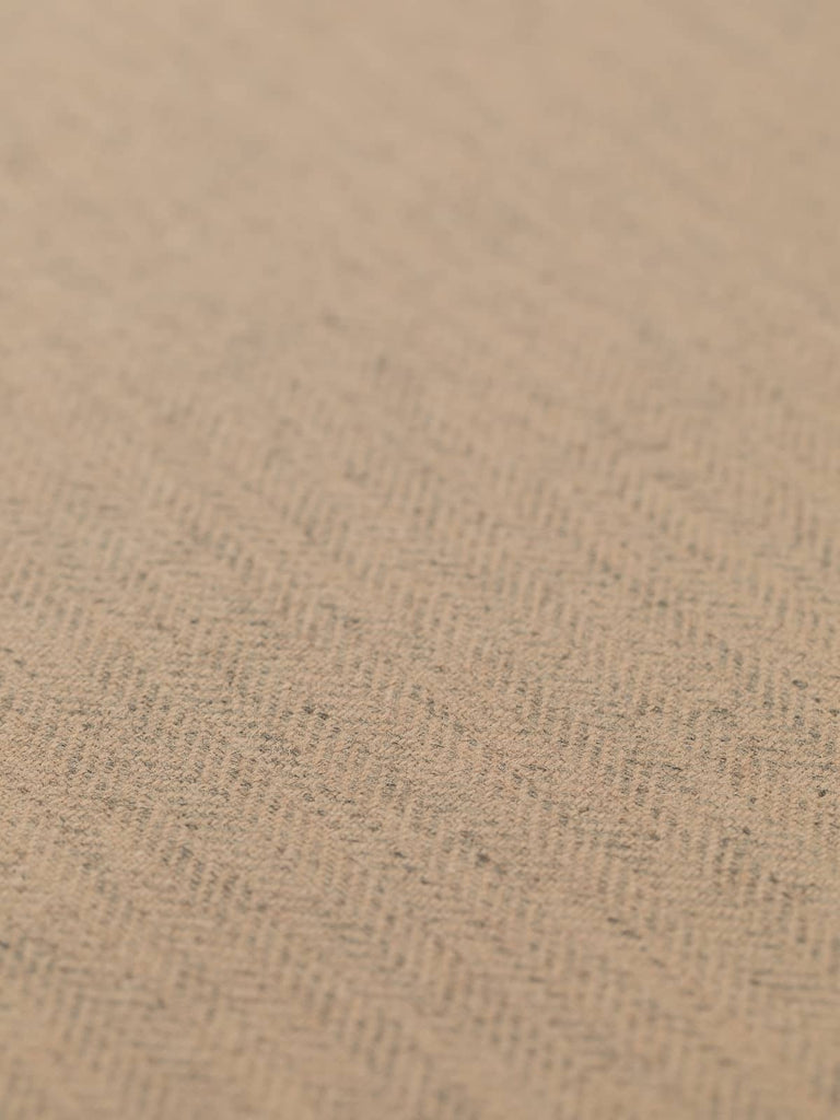 Angled flat view of Autumn Sand lightweight lambswool herringbone fabric, 290gsm, displaying classic chevron pattern in neutral beige and golden sand hues with subtle marled grey undertones