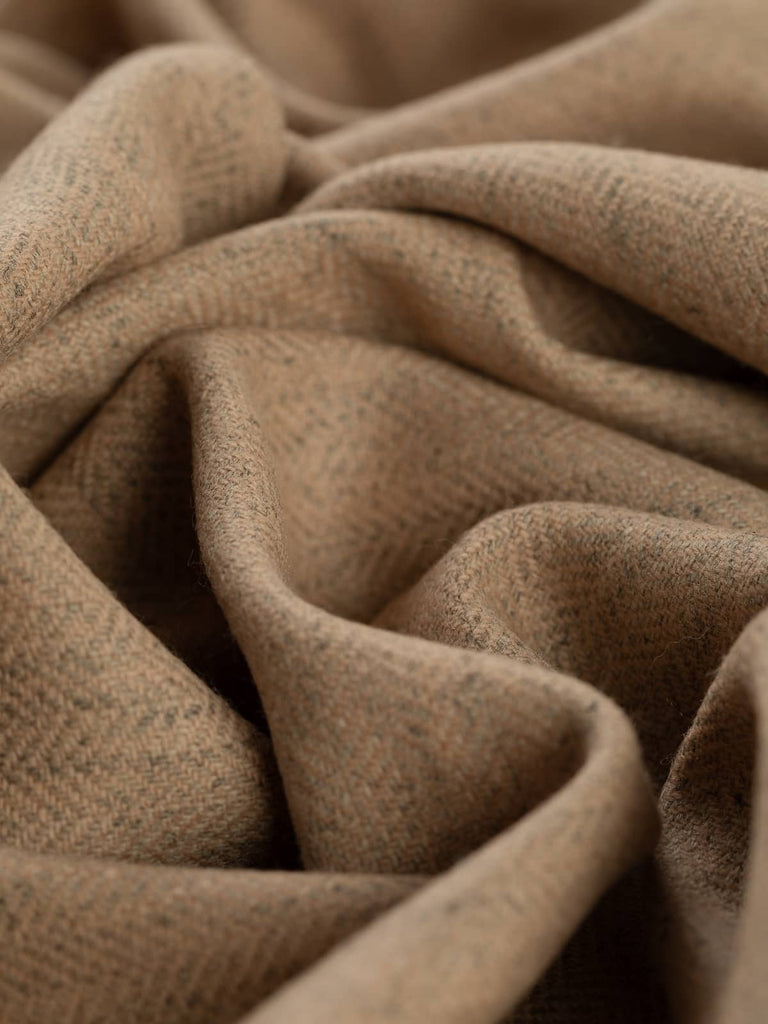 Twist of Autumn Sand Marled Yorkshire Tweed Herringbone, 100% lambswool, 150cm wide, showing soft golden sand and beige tones over a marled grey base in a fine herringbone weave
