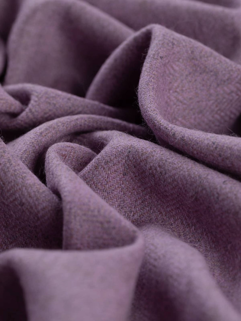 Twist of Autumn Lilac Marled Yorkshire Tweed Herringbone, 100% lambswool, 150cm wide, showing soft lavender and lilac hues over marled grey base in a fine, lightweight herringbone weave