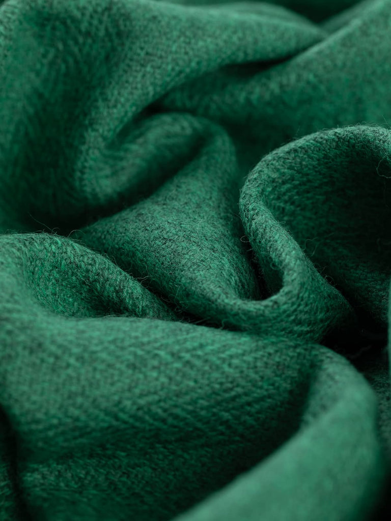 Twist of Pineridge Yorkshire Wool Herringbone Tweed, 100% wool, 154cm wide, showing pine-green and marled grey tones in a soft-brushed chevron weave inspired by misty evergreen ridges