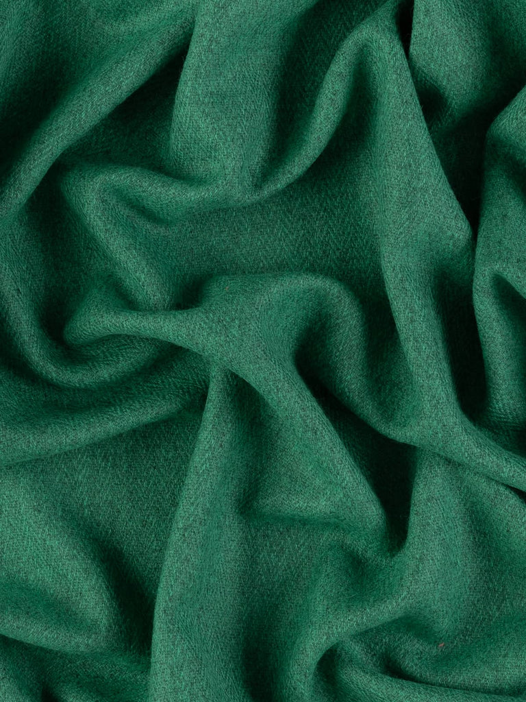 Overhead flat shot of Pineridge wool herringbone tweed, highlighting subtle chevron texture and tonal interplay of pine-green and grey yarns, evoking timeless British heritage craftsmanship