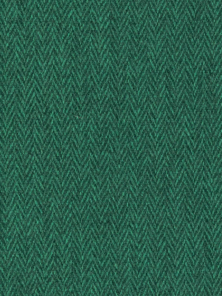 Overhead flat shot of Forest Tides Yorkshire Wool Tweed, highlighting pine-green and teal interplay across a softened chevron weave, evoking tranquil woodland reflections and timeless British craftsmanship