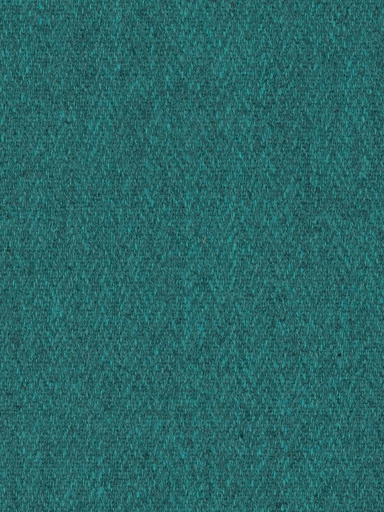 Overhead flat shot of Tealstone Yorkshire Herringbone Tweed, capturing the interplay of teal and grey melange yarns in a softened chevron weave, evoking calm coastal hues and timeless British craftsmanship