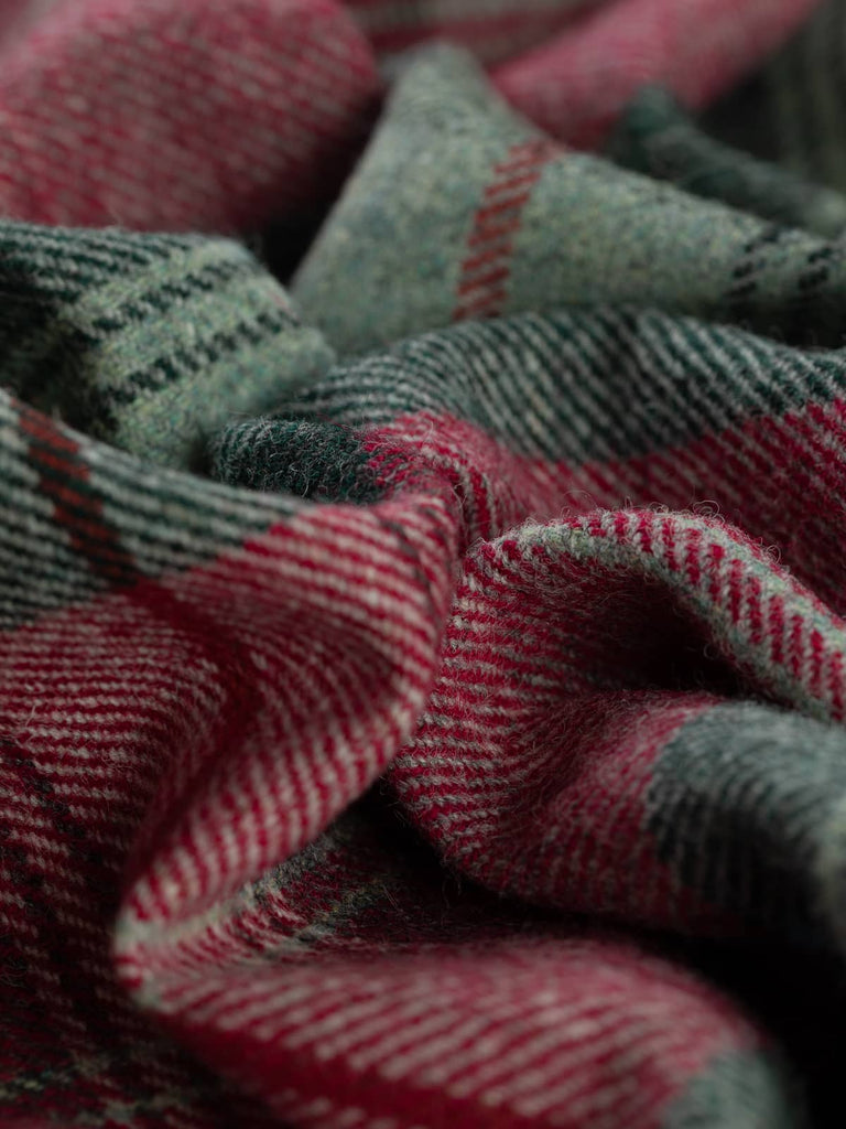 Twist of Woodland Dusk Yorkshire Tweed plaid, 100% wool, 155cm wide, showing heathered grey base, muted teal-aqua grey bands, charcoal-malachite green checks, and vibrant redcurrant accents