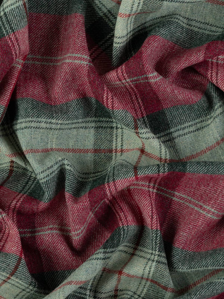 Overhead flat shot of Woodland Dusk Yorkshire woollen plaid, capturing dusk-inspired tones of weathered grey, aqua-forest melanges, and rich redcurrant hues across rugged wool surface with heritage red overcheck