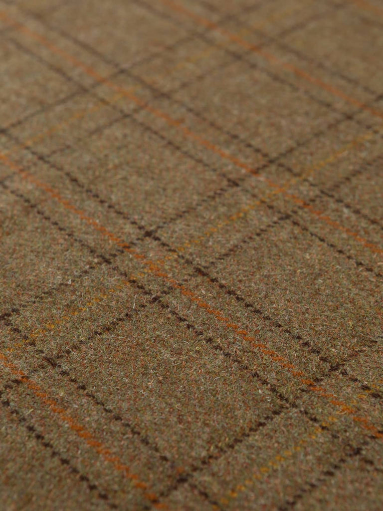 Flat angled shot of the Moorland Ember tweed displaying the earthy brown and green melange base with precise peat-brown windowpanes and subtle sunset-gold and rust checks.