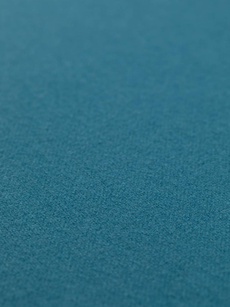 Flat angled view of Atlantic Depth hopsack fabric, 130cm wide, displaying even hopsack weave structure and rich stormy teal tone, ideal for outerwear and interiors