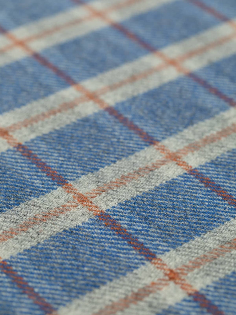 Angled flat view of Stargazer View Heritage Check, medium-weight wool with 5cm x 6cm repeat, highlighting cool sky-blue tones, marled grey tweed, and structural Cedarwood windowpane overcheck