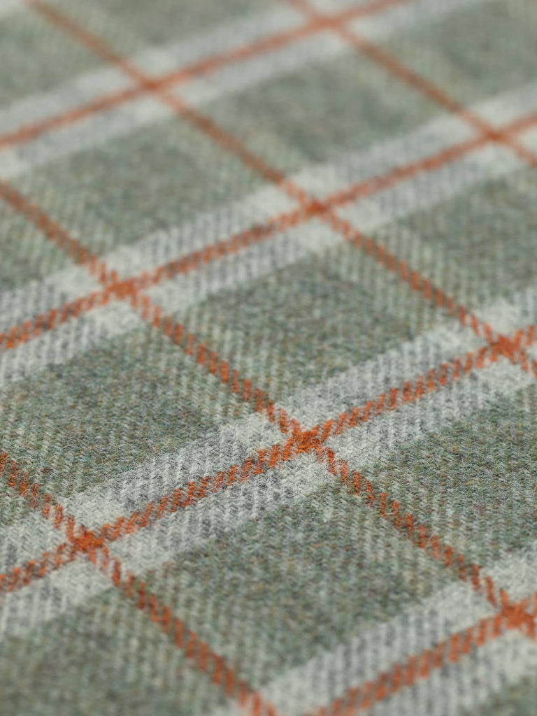 Angled flat view of Mossy View Heritage Check, medium-weight wool with 5cm x 6cm repeat, highlighting earthy green tones, frosted grey background, and structured Cedarwood windowpane accents