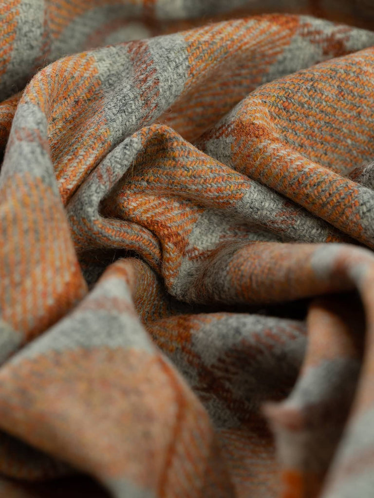Twist of Ember View Yorkshire Windowpane Check, 100% wool, 154cm wide, showing marled grey base with fiery orange melange and warm Cedarwood overcheck lines
