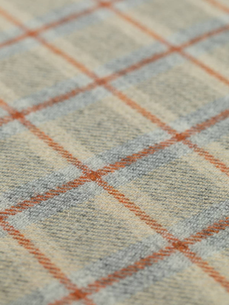 Angled flat view of Dune View Heritage Check, medium-weight wool with 5cm x 6cm repeat, highlighting soft golden tones, frosted grey foundation, and structured Cedarwood windowpane accents