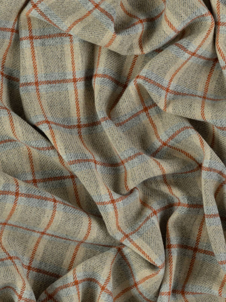 Overhead flat shot of Dune View Yorkshire woollen windowpane check, capturing marled grey foundation, sunlit sand melange squares, and red-hued Cedarwood overcheck across textured wool surface