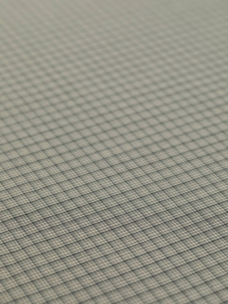 Spread-out image of the Iced Latte Chequerboard fabric, showing its elegant neutral palette of sand and dark smoke-grey hues. The fabric’s fine worsted weave is enhanced with elastane for comfortable stretch and stability, ideal for creating stylish blazers, fitted dresses, and versatile separates.