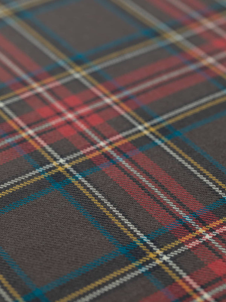 Flat angled view of Princess Mary Muted Tartan worsted wool, highlighting 13.5cm x 11.5cm repeat of softened royal-inspired tartan sett