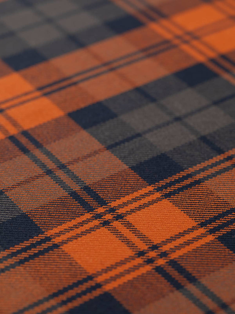 Flat angled view of Autumn Watch tartan worsted wool, highlighting 22.5cm x 27.5cm repeat in rich seasonal palette of orange, brown, and navy