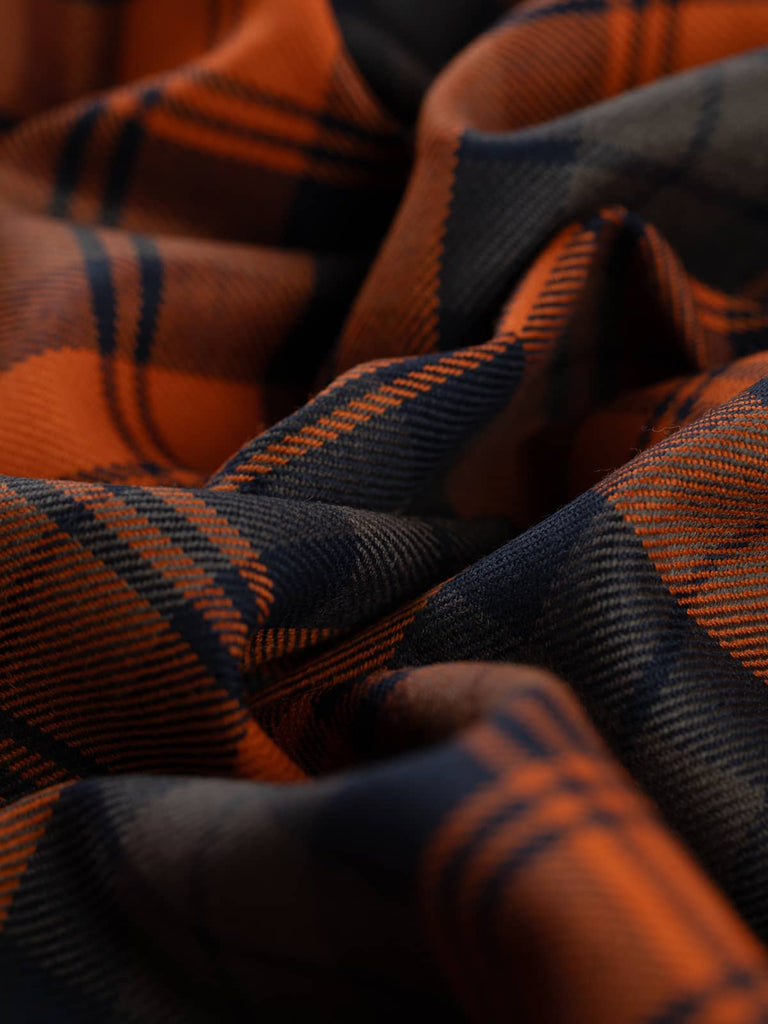 Twist of Autumn Watch tartan 100% wool fabric, showing soft drape, twill weave, and warm autumnal reinterpretation of classic Black Watch set