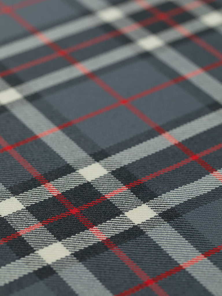 Flat angled view of Thompson Grey tartan worsted wool, highlighting 11.5cm x 14cm repeat with versatile grey, red, black, and white sett