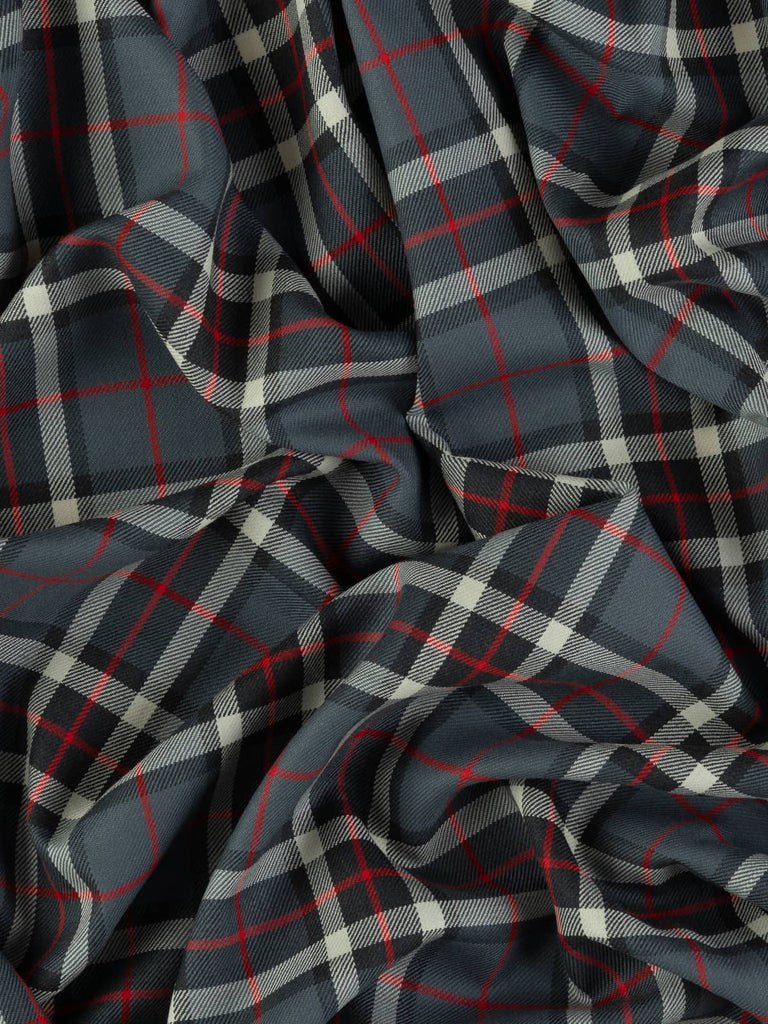 Twist of Thompson Grey tartan 100% wool fabric, showing soft drape, twill weave, and refined check pattern rooted in Scottish heritage