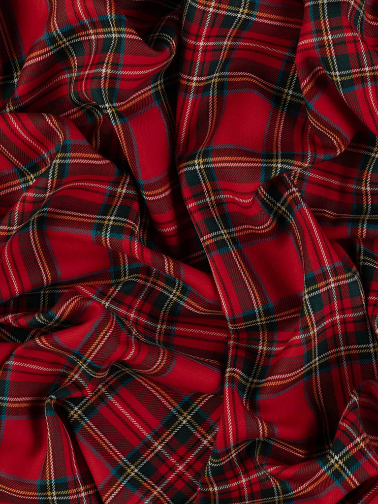 Twist of Royal Stewart tartan 100% wool worsted, highlighting soft drape, twill weave texture, and vibrant multicoloured sett rooted in royal heritage and punk fashion