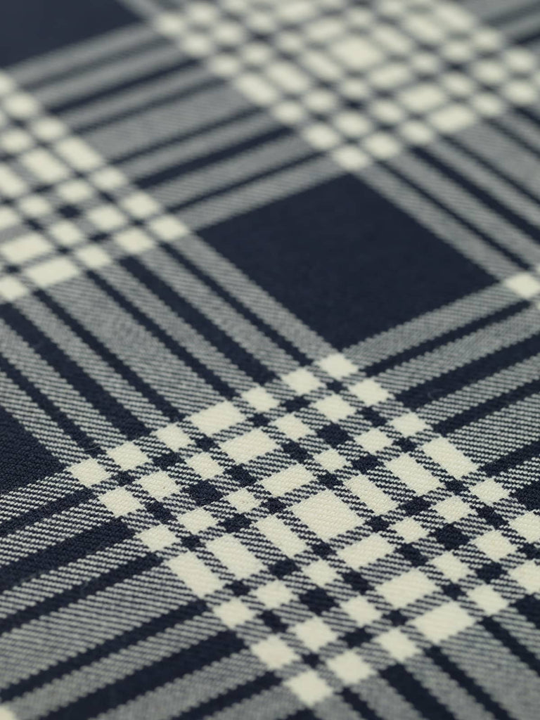 Flat angled view of Navy Menzies tartan fabric, 10.5cm x 13cm repeat, displaying dark navy ground intersected by sharp white checks for a minimal yet bold design