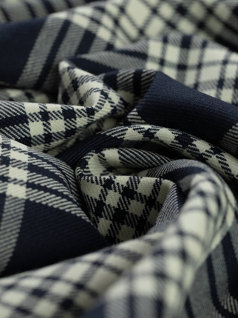 Twist of Navy Menzies tartan 100% wool worsted, highlighting refined twill weave texture, smooth drape, and crisp navy and white contrast