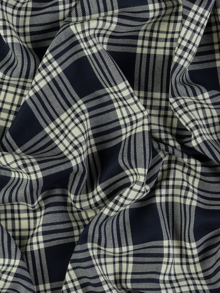 Twist of Navy Menzies tartan 100% wool worsted, highlighting refined twill weave texture, smooth drape, and crisp navy and white contrast