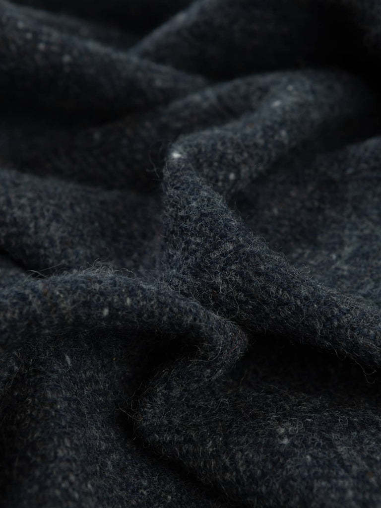 Twist of Slate Cascade Tweed showing multi-tonal greys and deep navy with classic Donegal neps and lightly brushed wool texture for soft warmth.
