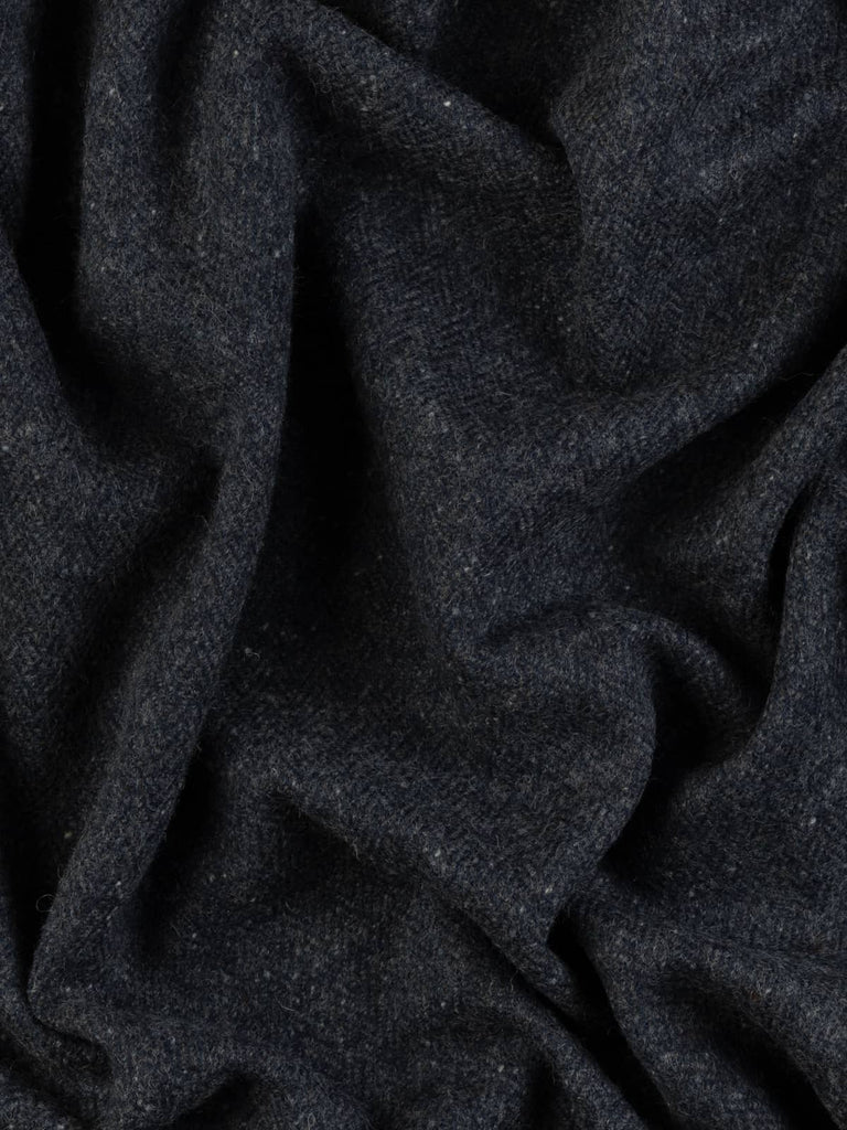 Twist of Slate Cascade Tweed showing multi-tonal greys and deep navy with classic Donegal neps and lightly brushed wool texture for soft warmth.