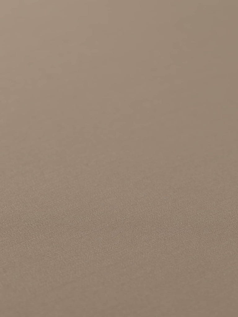 Flat, angled view of Desert Sand fabric laid out to showcase the even, fine twill weave and silky texture. The warm sand beige color, with faint grey undertones, makes it ideal for tailored garments or smart accessories with a minimalist, military-inspired edge.