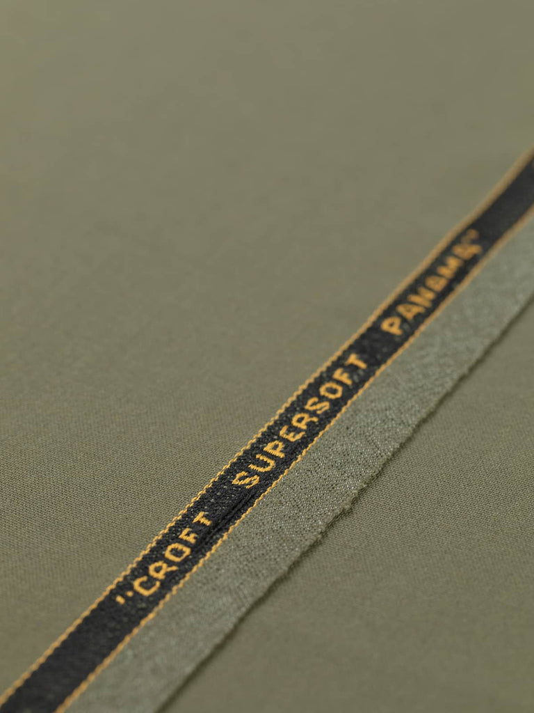 Flat, angled view of Dusted Olive fabric, capturing its superfine twill texture, all-over solid tone, and refined, understated style.