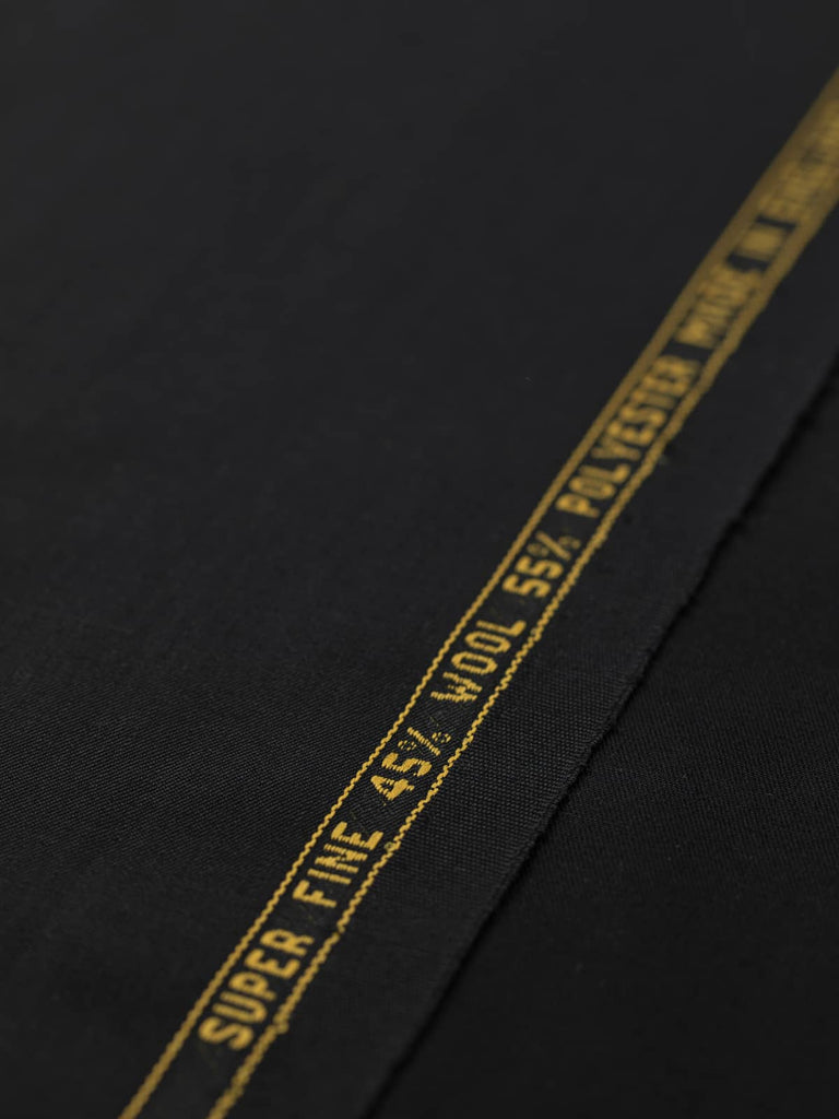 Flat angled view of Black Obsidian wool-blend, highlighting its deep black tone, classic twill structure, and even, smooth surface texture.