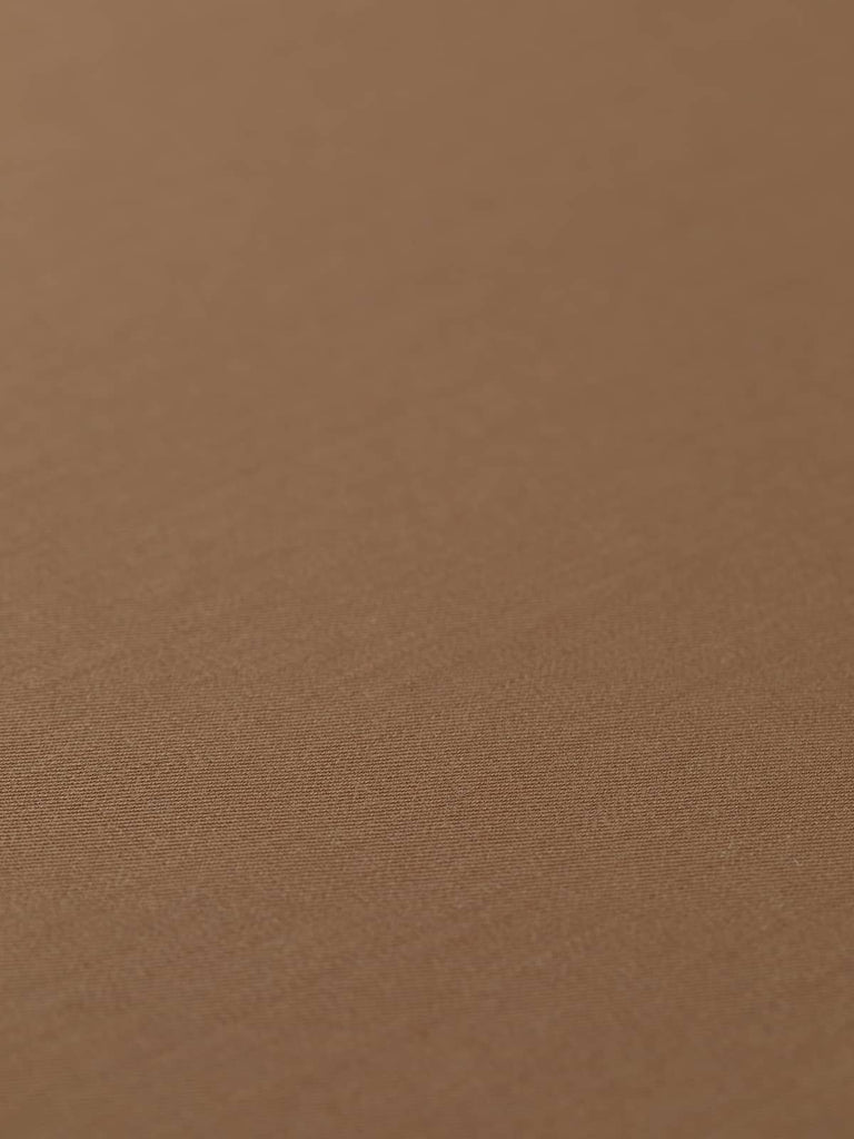 Flat angled view of Classic Tan wool-blend fabric, highlighting its refined twill gabardine texture, silky smooth handle, and versatile neutral tone.