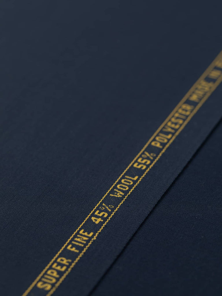 Flat angled view of Twilight Navy wool-blend twill, highlighting its refined worsted finish, crease resistance, and timeless deep blue tone.