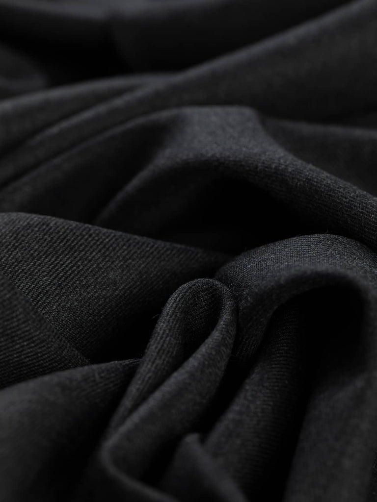 Twist of Smoke Marl wool-blend twill fabric, showing smooth gabardine texture, crisp handle, and fluid soft drape in versatile grey shade