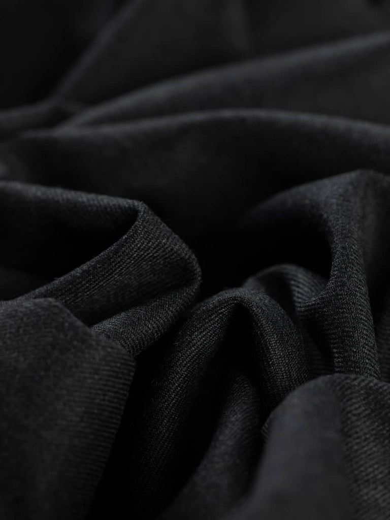 Twist of Smoke Marl wool-blend twill fabric, showing smooth gabardine texture, crisp handle, and fluid soft drape in versatile grey shade