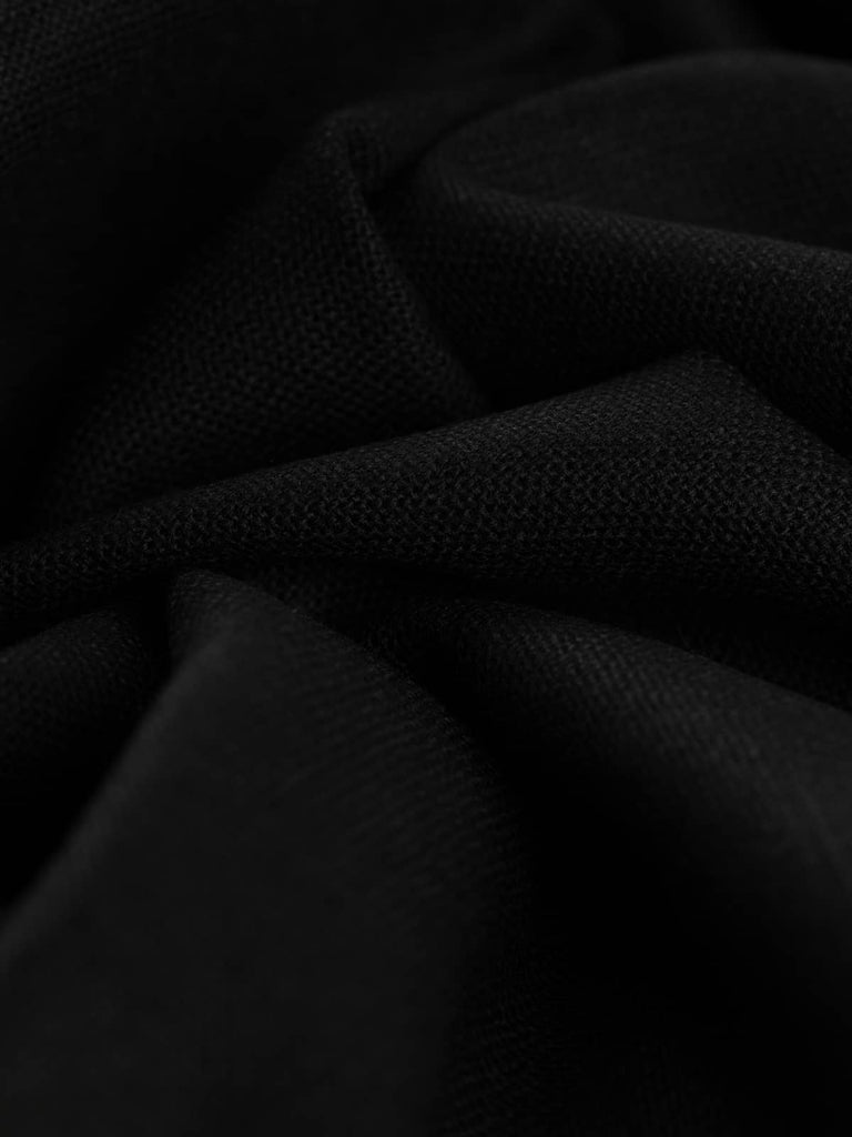 Twist of Jet Weave wool Panama weave fabric, showing refined texture, lustrous sheen, and weighty drape in classic black shade