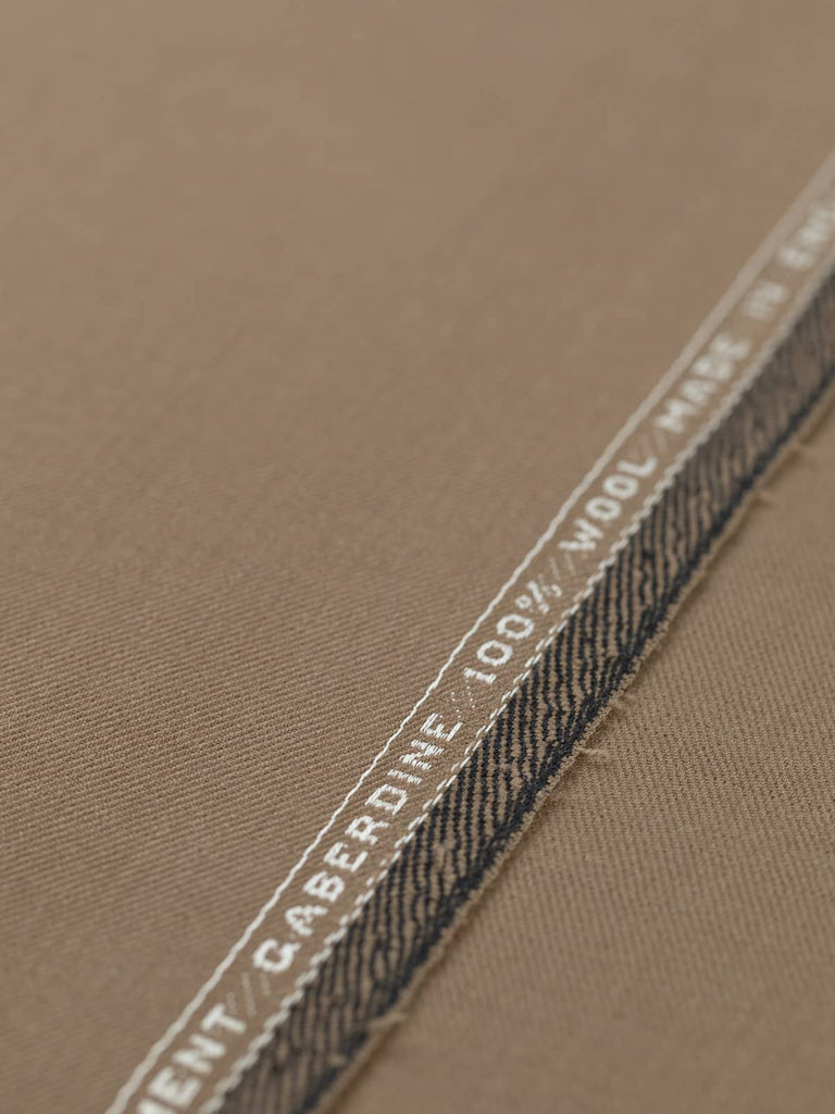 Flat angled view of Toasted Caramel wool twill fabric, showing refined finish, autumnal hue, and subtle lustrous sheen