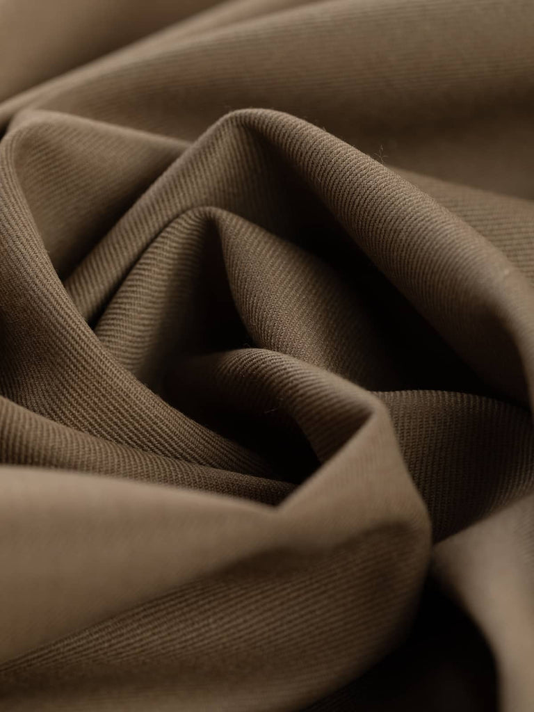 Twist of Toasted Caramel wool gabardine fabric, highlighting soft worsted texture, fluid drape, and warm earthy caramel tone
