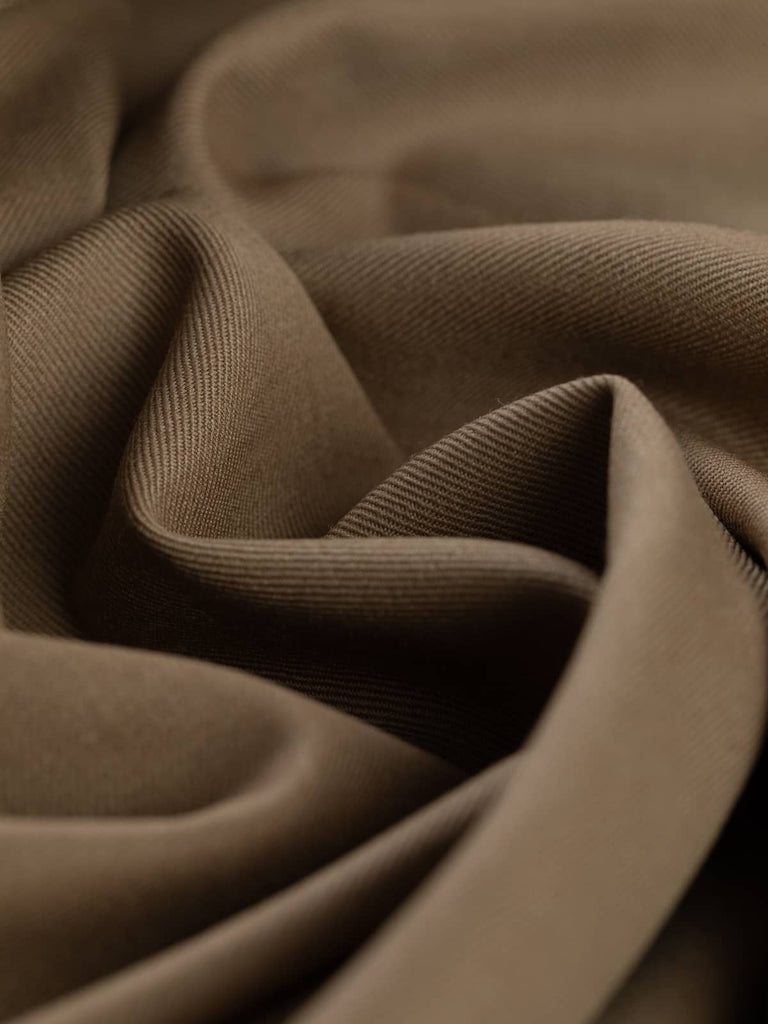 Twist of Toasted Caramel wool gabardine fabric, highlighting soft worsted texture, fluid drape, and warm earthy caramel tone