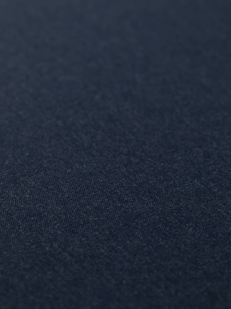 Flat angled view of Deep Abyss wool fabric, highlighting smooth gabardine weave, refined sheen, and dark marine blue hue