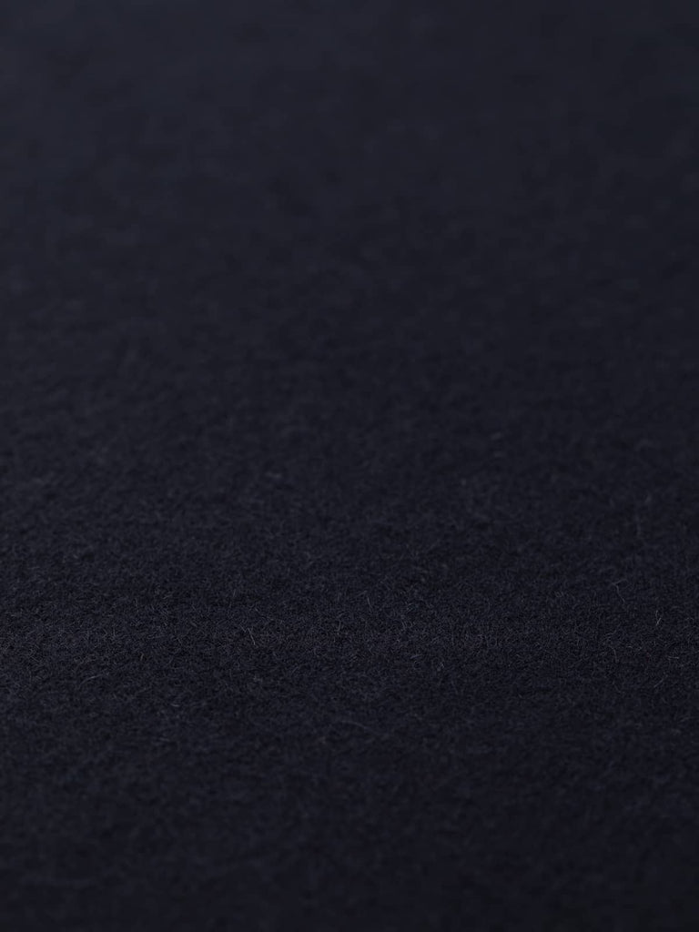 Flat angled view of Blushed Oat wool fabric, highlighting fine twill weave, silky surface, and gentle blush-beige shade