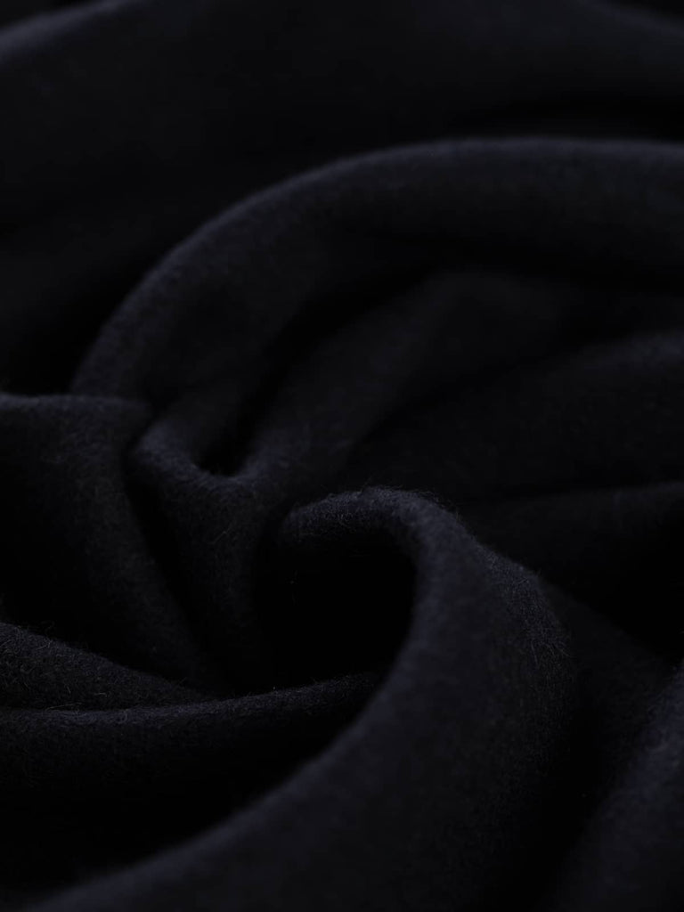 Twist of Blushed Oat 100% wool suiting fabric, showing smooth drape, soft brushed texture, and muted almond hue