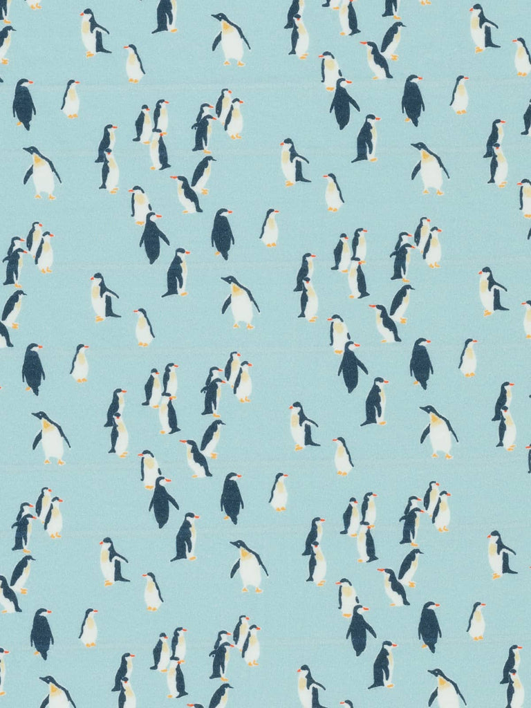 Blue printed penguin animal design on blue jersey fabric