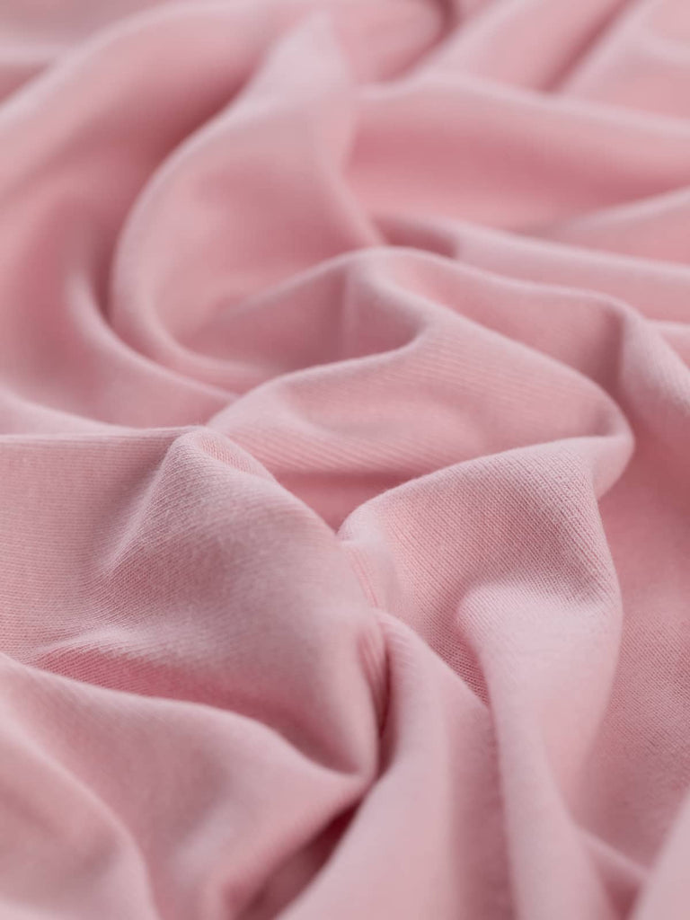 Angled twist picture of pink cotton interlock