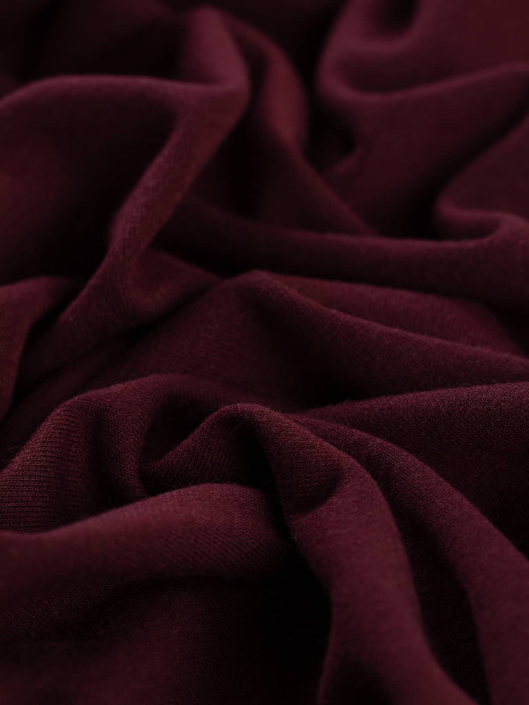 Autumn Berry Ponte de Roma is a lightweight, soft double jersey with rich dark berry hues. Its excellent two-way stretch and fluid drape make it ideal for stylish tops, dresses, and relaxed separates.