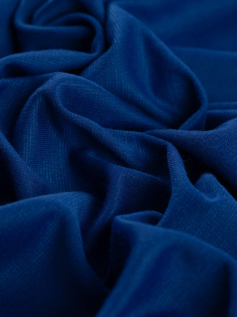 Precious Sapphire Ponte de Roma is a luxurious, jewel-toned royal blue fabric with a soft, smooth feel. Its excellent two-way stretch and fluid drape make it perfect for stylish tops, dresses, and relaxed separates.