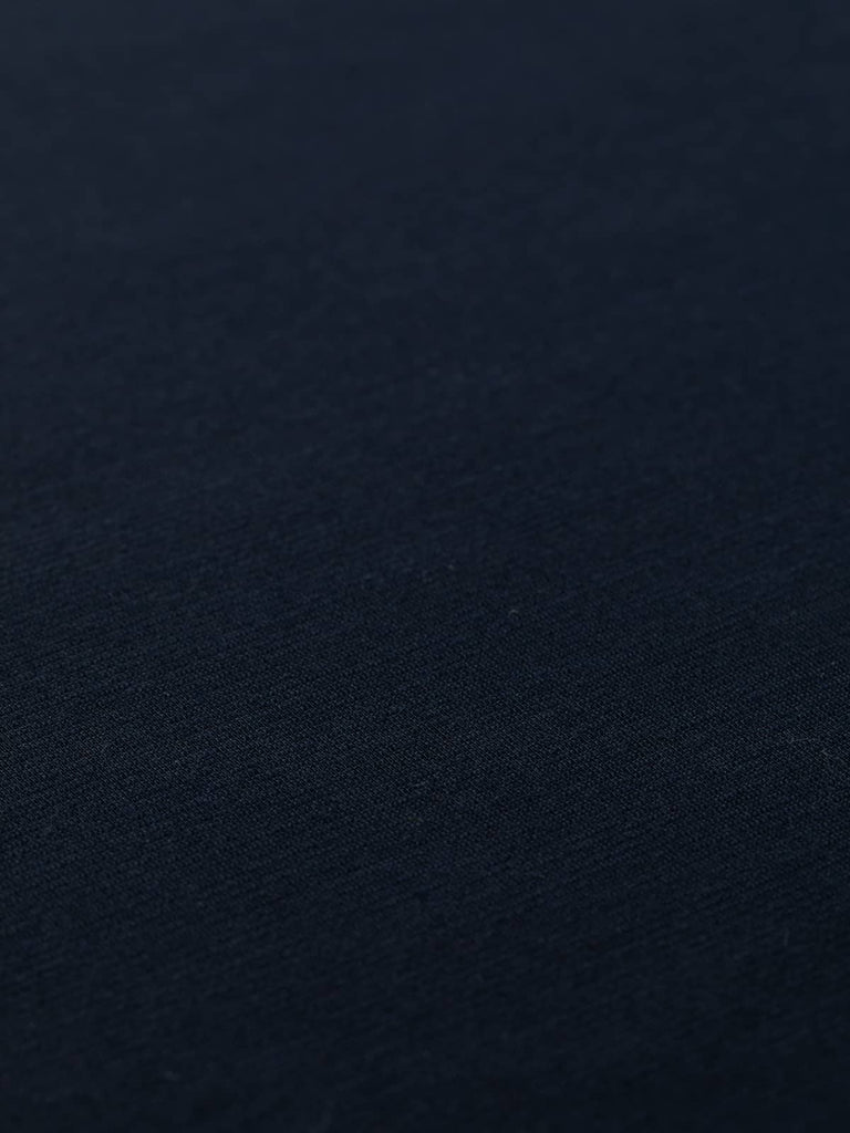 This lightweight Ponte jersey features a superfine horizontal ribbed knit, offering soft comfort with good opacity. The deep navy hue is a stylish alternative to black, perfect for versatile wardrobe staples.