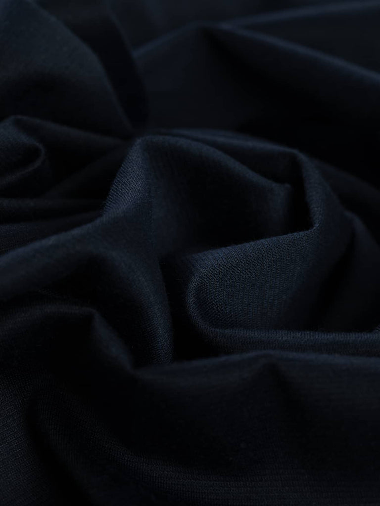 Iolite Navy Ponte de Roma is a deep, intense navy blue with a rich, jewel-toned allure. Its fluid drape and excellent stretch make it an elegant yet practical choice for timeless garments.